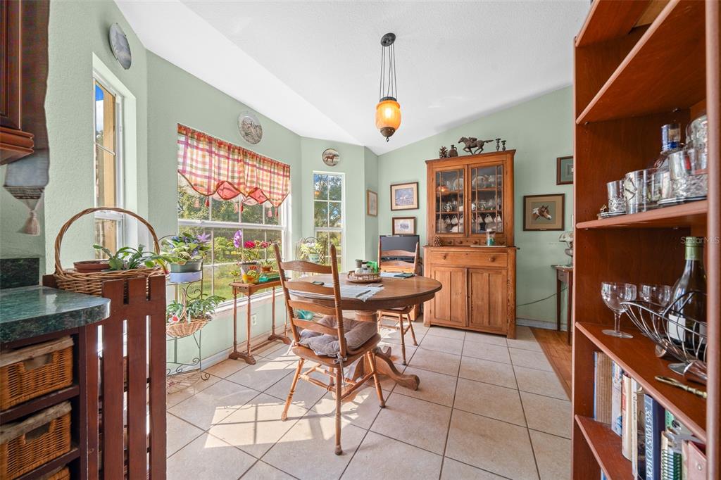 399 Northeast 155 Place Citra, FL 32113 - Photo 26 of 58 a view of a dining room with furniture and a window