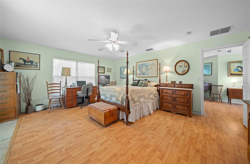 399 Northeast 155 Place Citra, FL 32113 - Photo 29 of 58 a bedroom with furniture and a large mirror