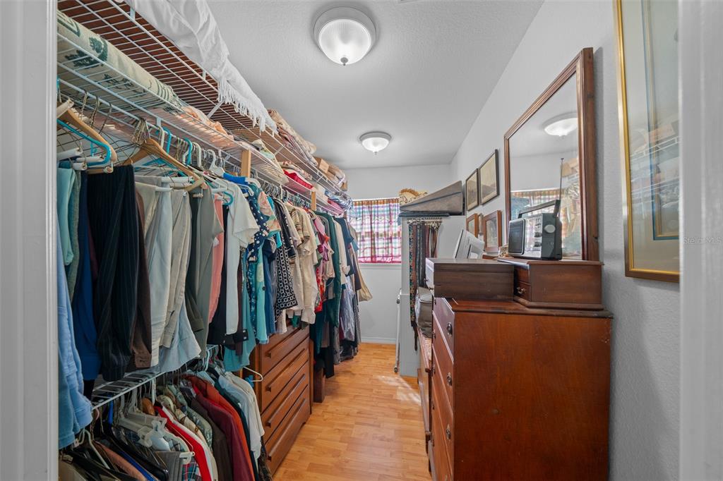 399 Northeast 155 Place Citra, FL 32113 - Photo 31 of 58 a view of walk in closet with clothes and shoes