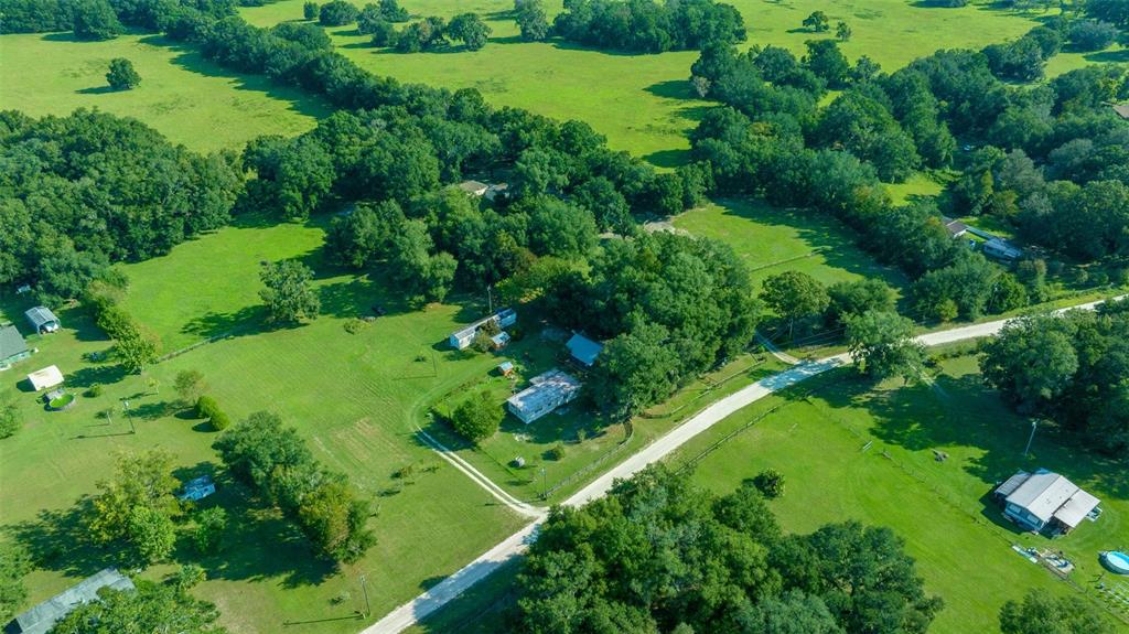 399 Northeast 155 Place Citra, FL 32113 - Photo 47 of 58 a view of a garden with a yard