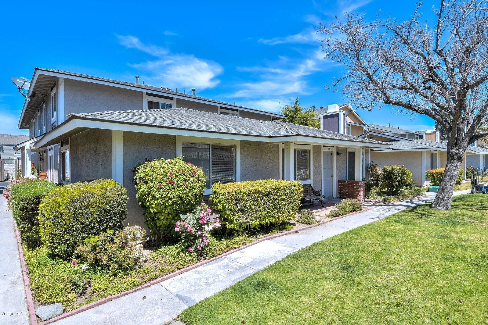 547 Spring Road, Unit 33 Moorpark, CA 93021 - Photo 1 of 28 a front view of a house with garden