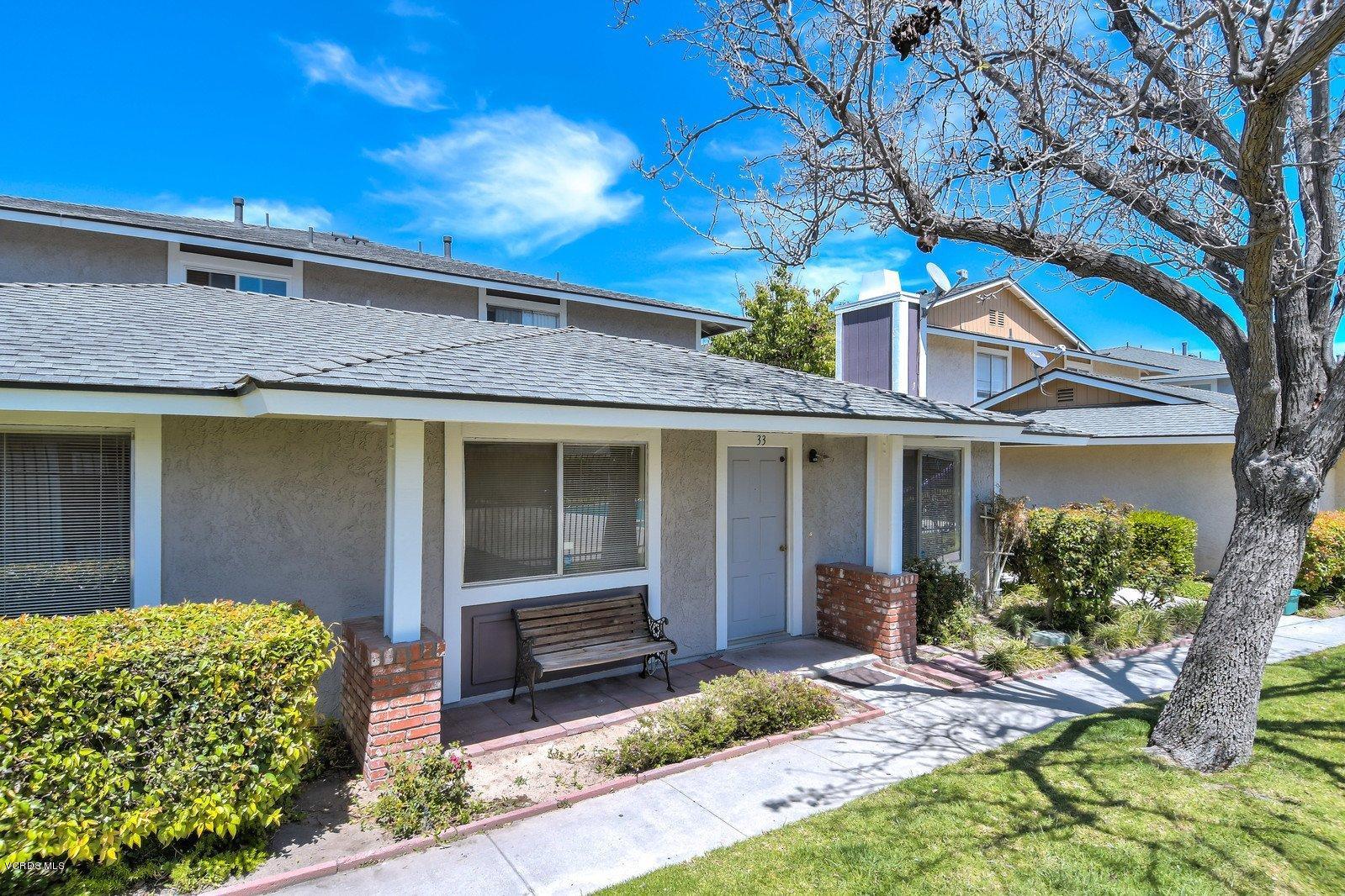 547 Spring Road, Unit 33 Moorpark, CA 93021 - Photo 2 of 28 a front view of a house with garden