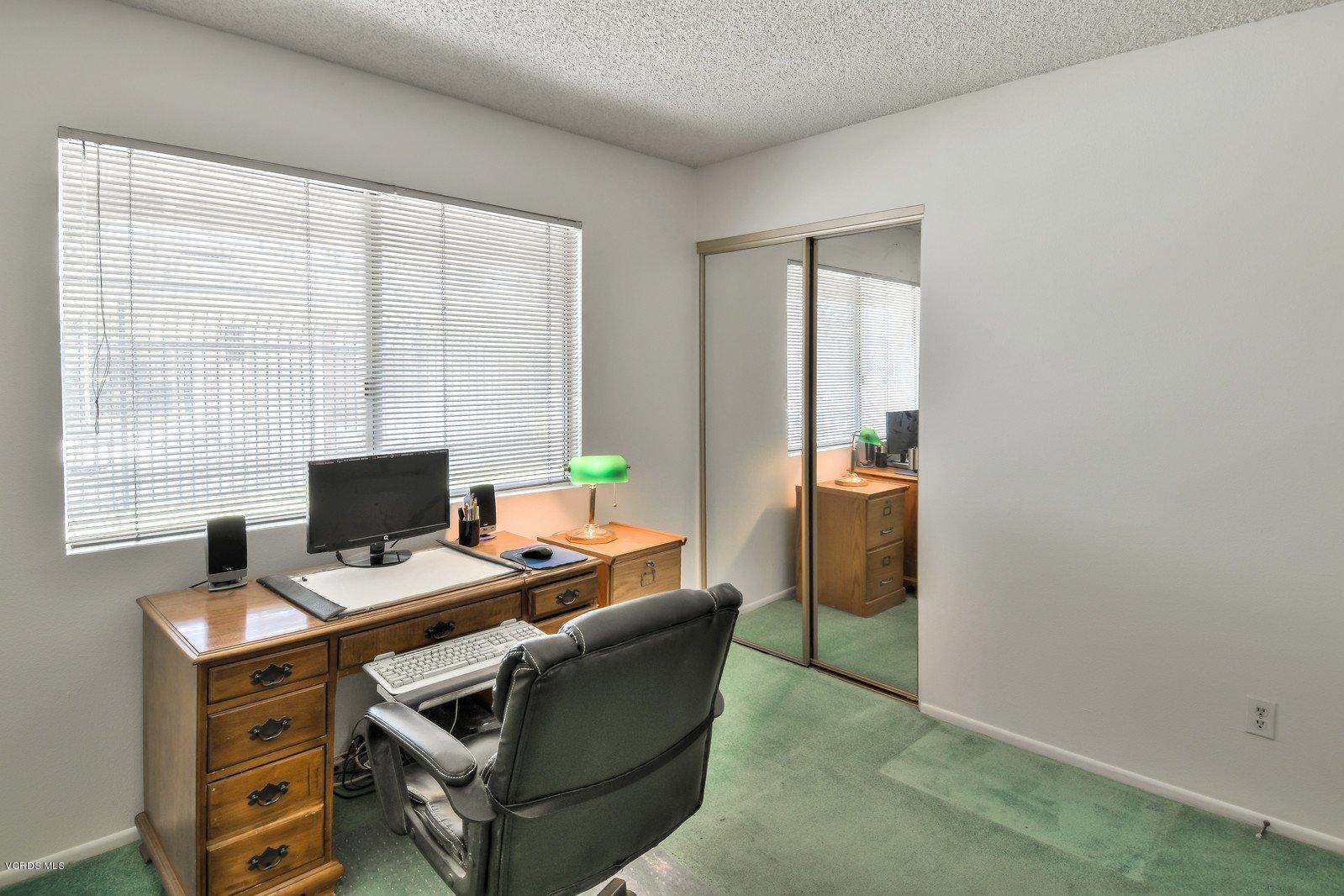 547 Spring Road, Unit 33 Moorpark, CA 93021 - Photo 13 of 28 a work room with furniture and window