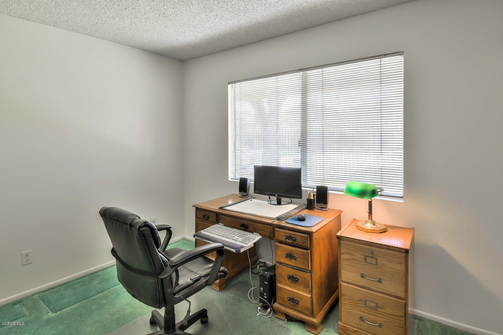 547 Spring Road, Unit 33 Moorpark, CA 93021 - Photo 14 of 28 a view of a workspace with furniture and a window