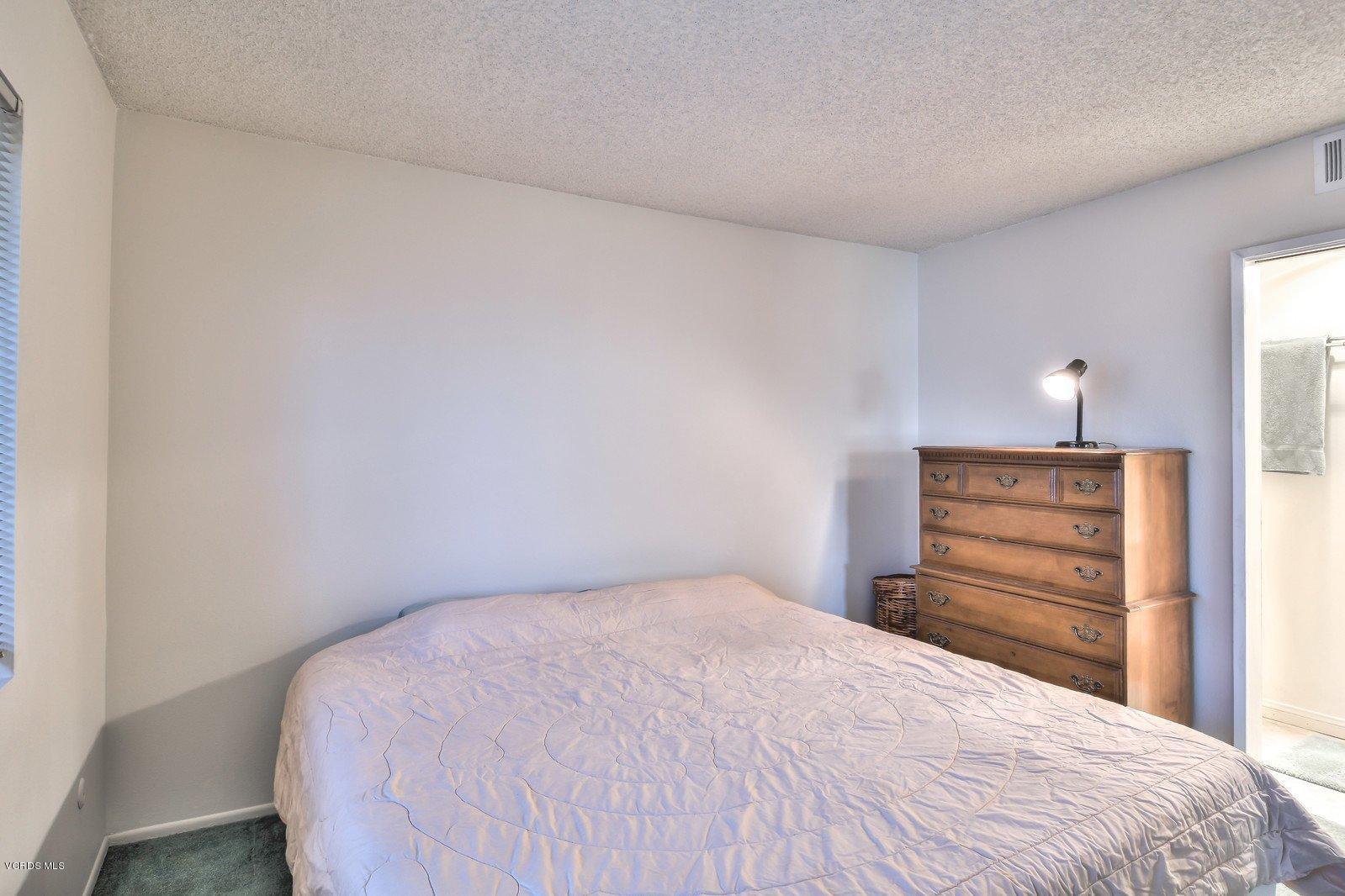 547 Spring Road, Unit 33 Moorpark, CA 93021 - Photo 15 of 28 a bedroom with a bed and a closet