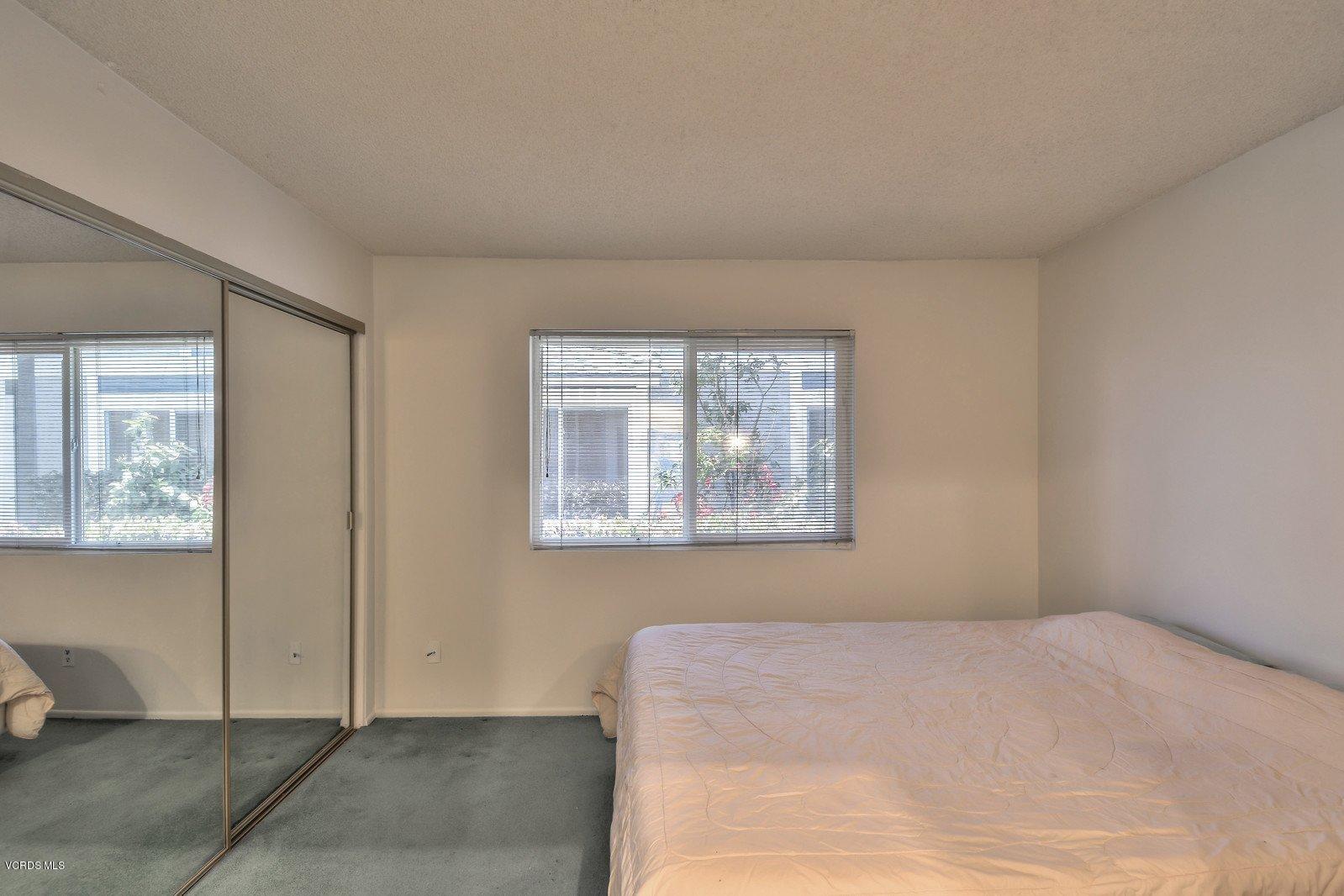 547 Spring Road, Unit 33 Moorpark, CA 93021 - Photo 17 of 28 a bedroom with a bed and a window
