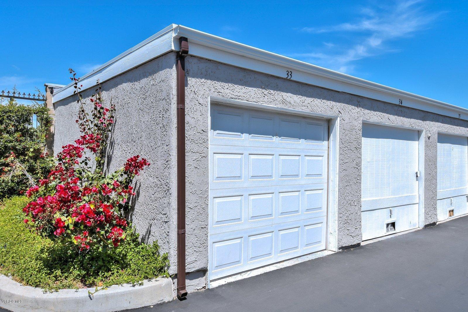 547 Spring Road, Unit 33 Moorpark, CA 93021 - Photo 25 of 28 a view of a house with a flower garden