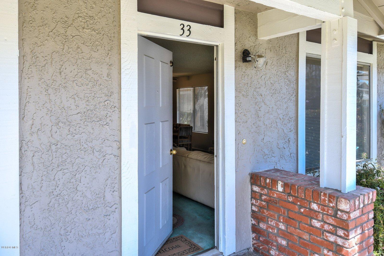 547 Spring Road, Unit 33 Moorpark, CA 93021 - Photo 5 of 28 a bathroom with a granite countertop shower and a sink