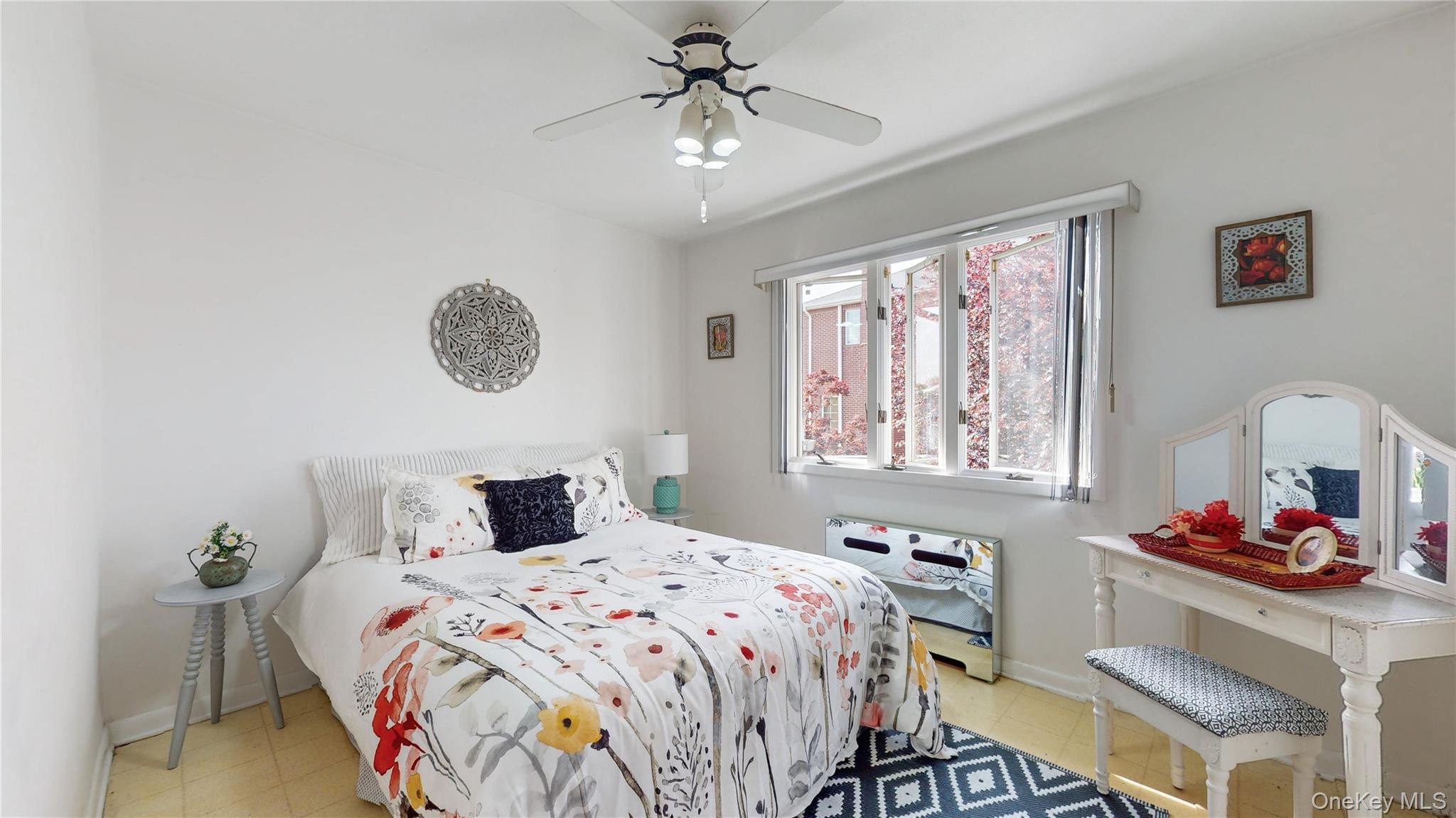 52-04 Redfield Street Queens, NY 11362 - Photo 11 of 25 Bedroom with baseboards and a ceiling fan