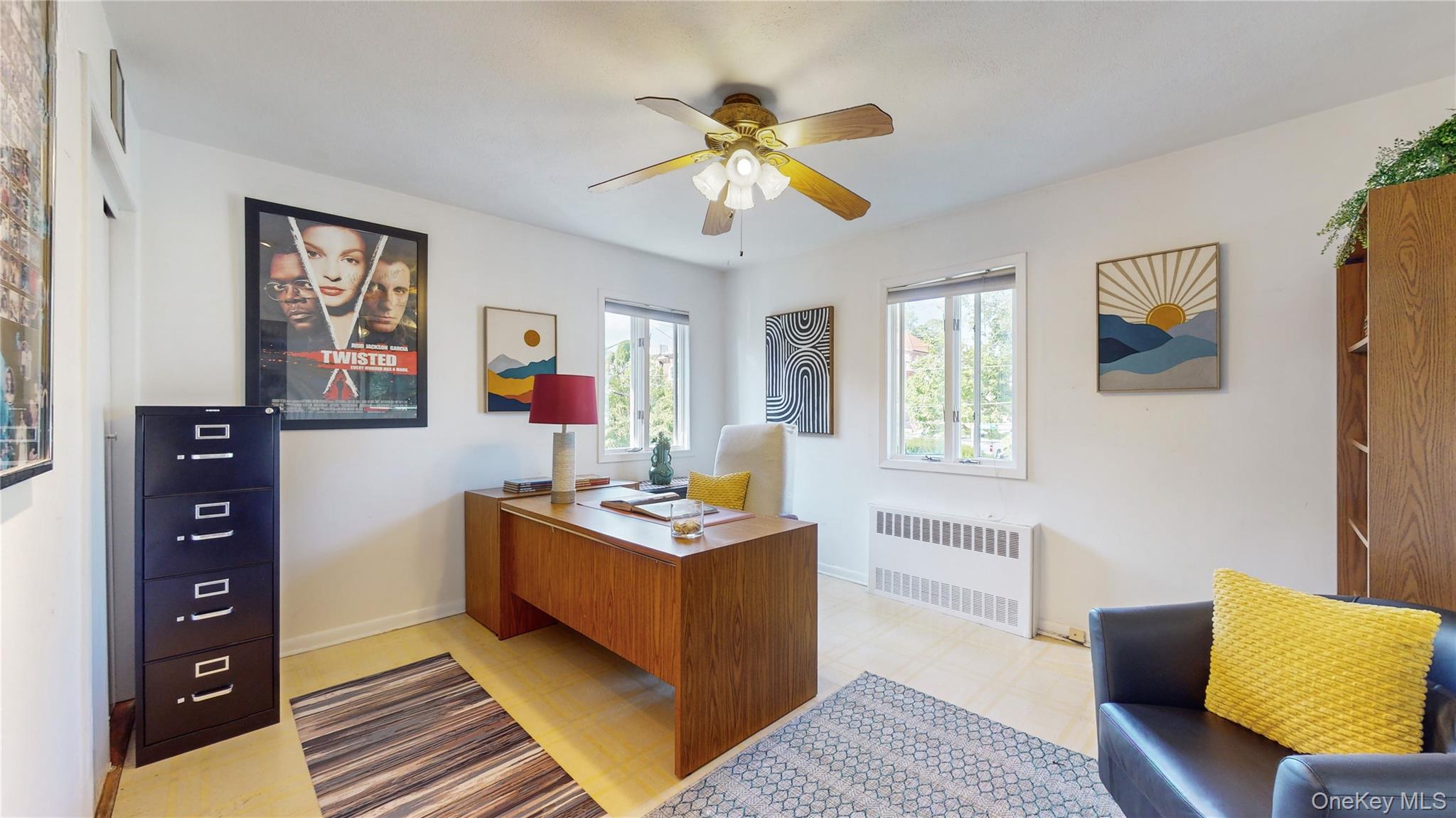 52-04 Redfield Street Queens, NY 11362 - Photo 15 of 25 Home office featuring radiator heating unit, ceiling fan, baseboards, and light floors