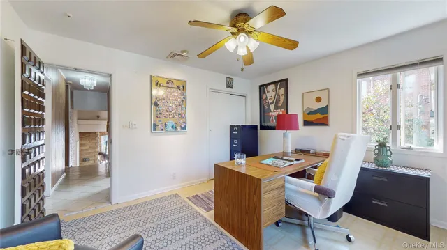 a workspace with furniture and window