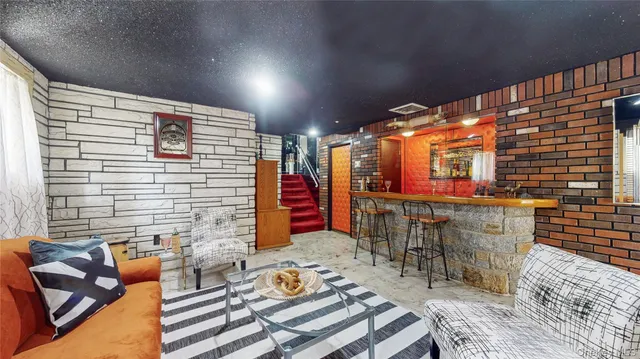 a view of barbecue area with seating