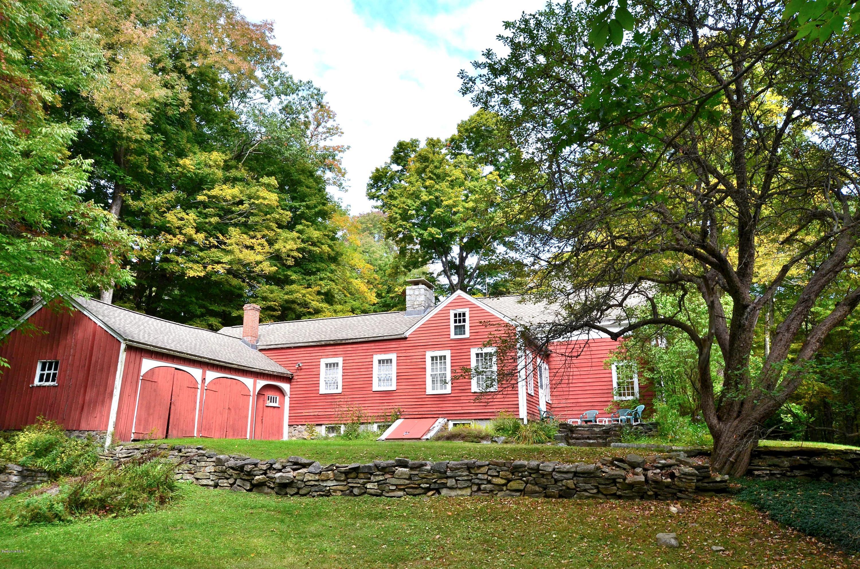 246 Judd Road Otis, MA 01253 - Photo 4 of 21 a front view of a house with a yard and a large tree