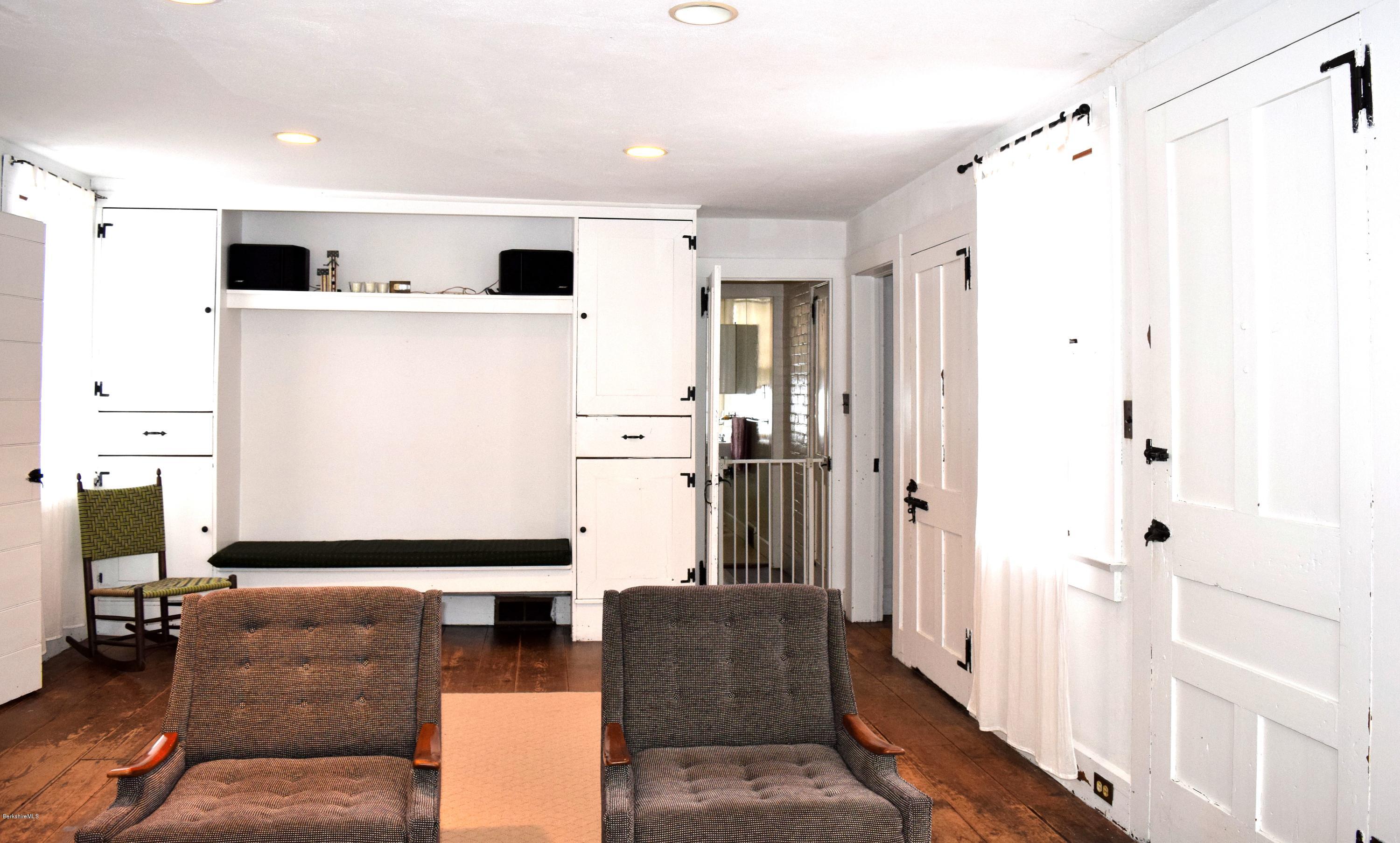 246 Judd Road Otis, MA 01253 - Photo 9 of 21 a living room with furniture and a flat screen tv