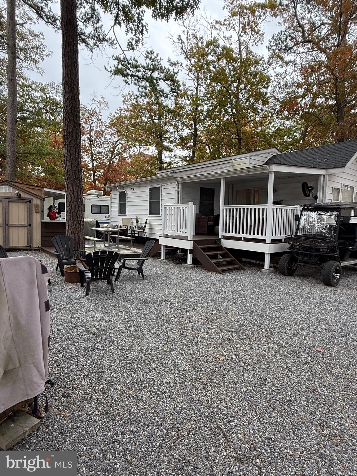 515 Corsons Tavern Road, Unit D22 Ocean View, NJ 08230 - Photo 12 of 23 a view of a house with a patio and a yard