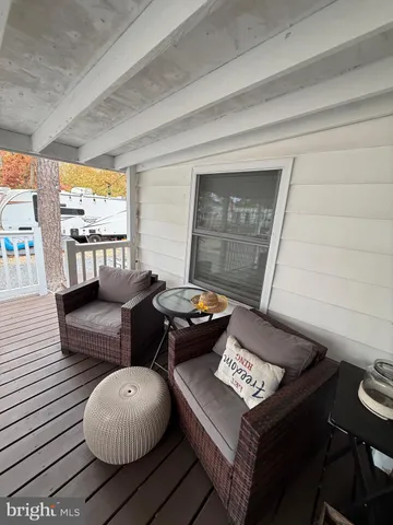 a terrace of a house with outdoor seating