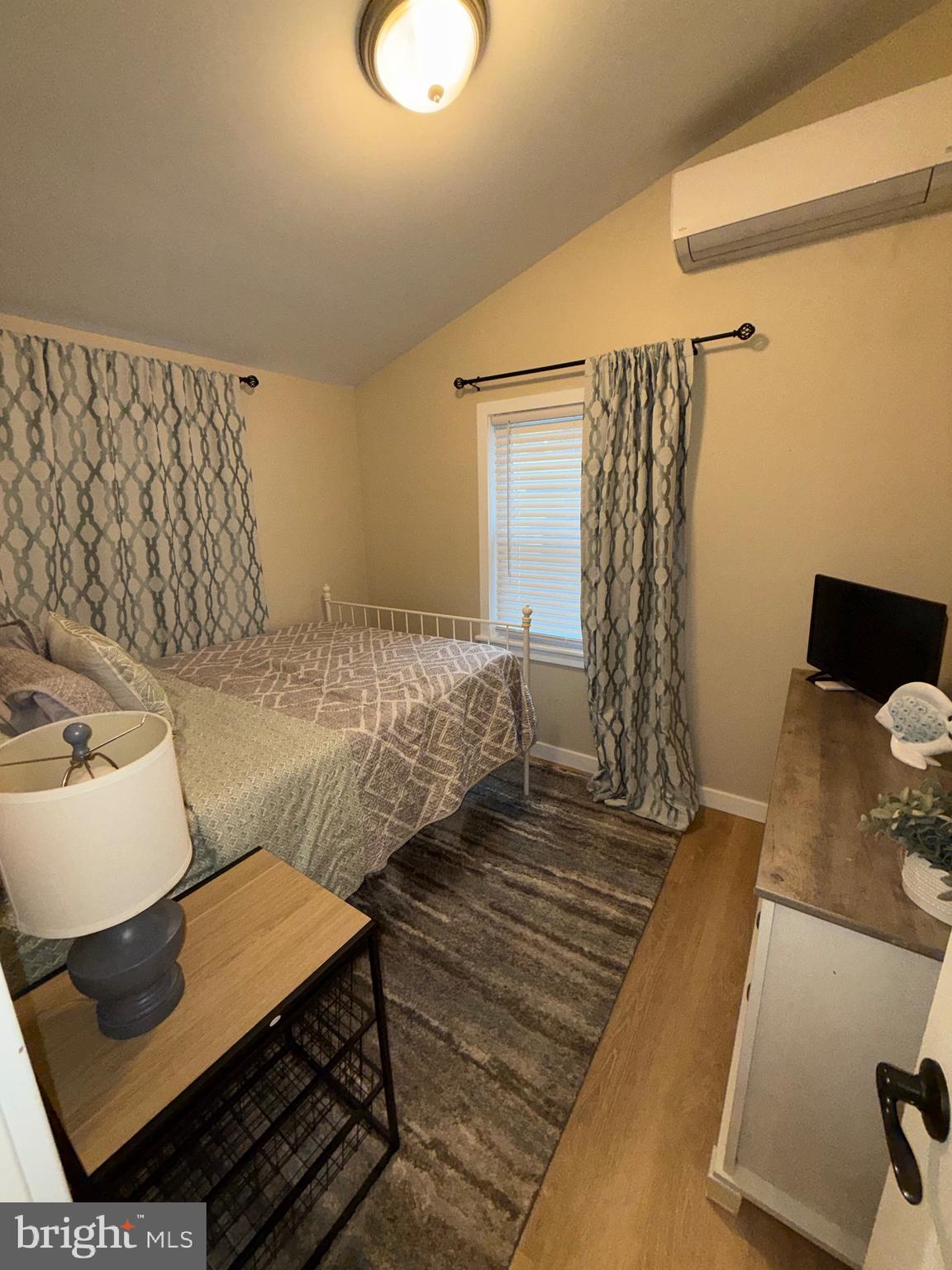 515 Corsons Tavern Road, Unit D22 Ocean View, NJ 08230 - Photo 7 of 23 a bedroom with a bed and a couch