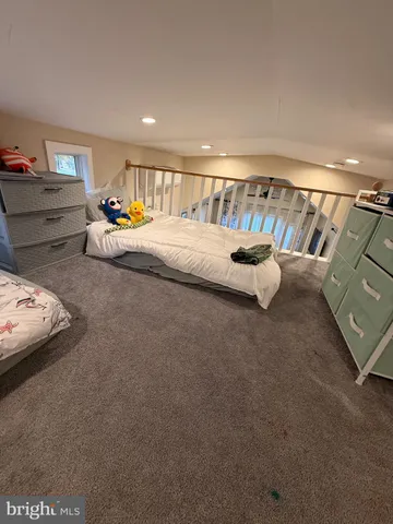 a view of a bedroom with a bed