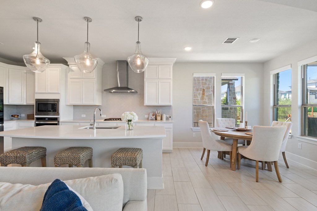 741 Rawson Bend Austin, TX 78738 - Photo 11 of 40 The island kitchen is made for the home chef who loves to entertain with bar seating.