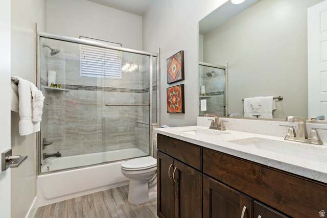 2600 Ocotillo Way, Unit 31 Santa Clara, UT 84765 - Photo 30 of 73 Bathroom featuring a dual-sink vanity with white countertops, dark wood cabinetry, and brushed nickel fixtures