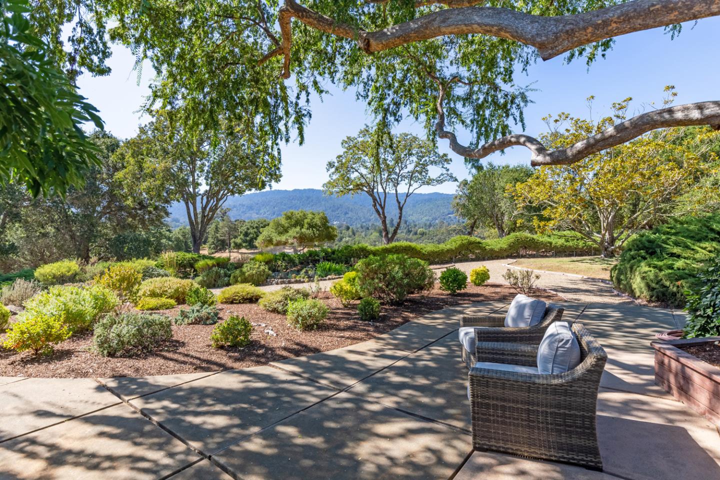 2885 Woodside Road Woodside, CA 94062 - Photo 12 of 19 a view of backyard with outdoor seating and plants