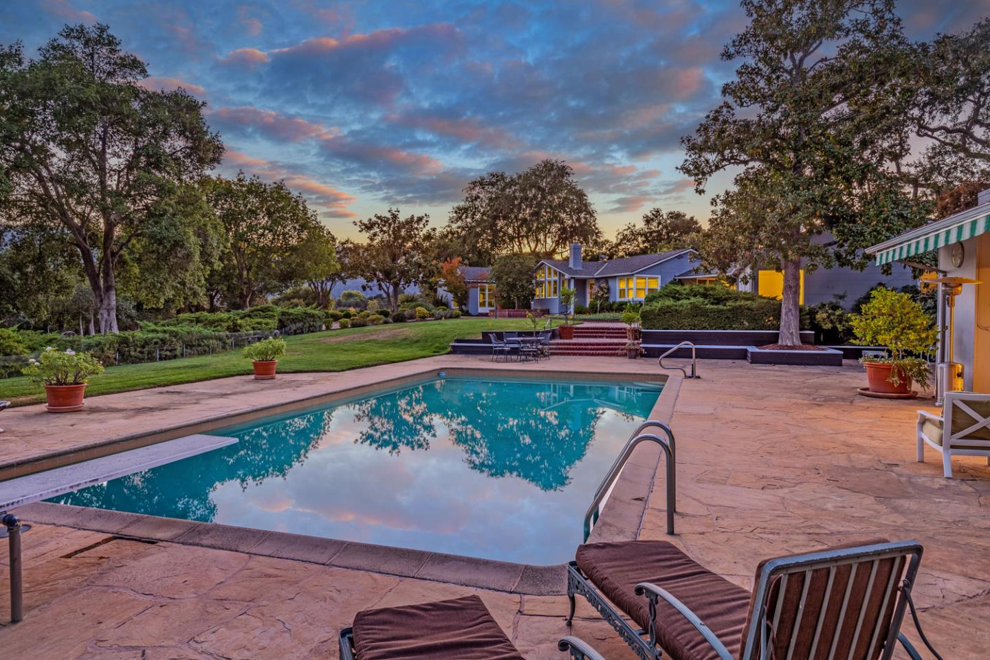 2885 Woodside Road Woodside, CA 94062 - Photo 15 of 19 a view of a swimming pool with a patio and a yard