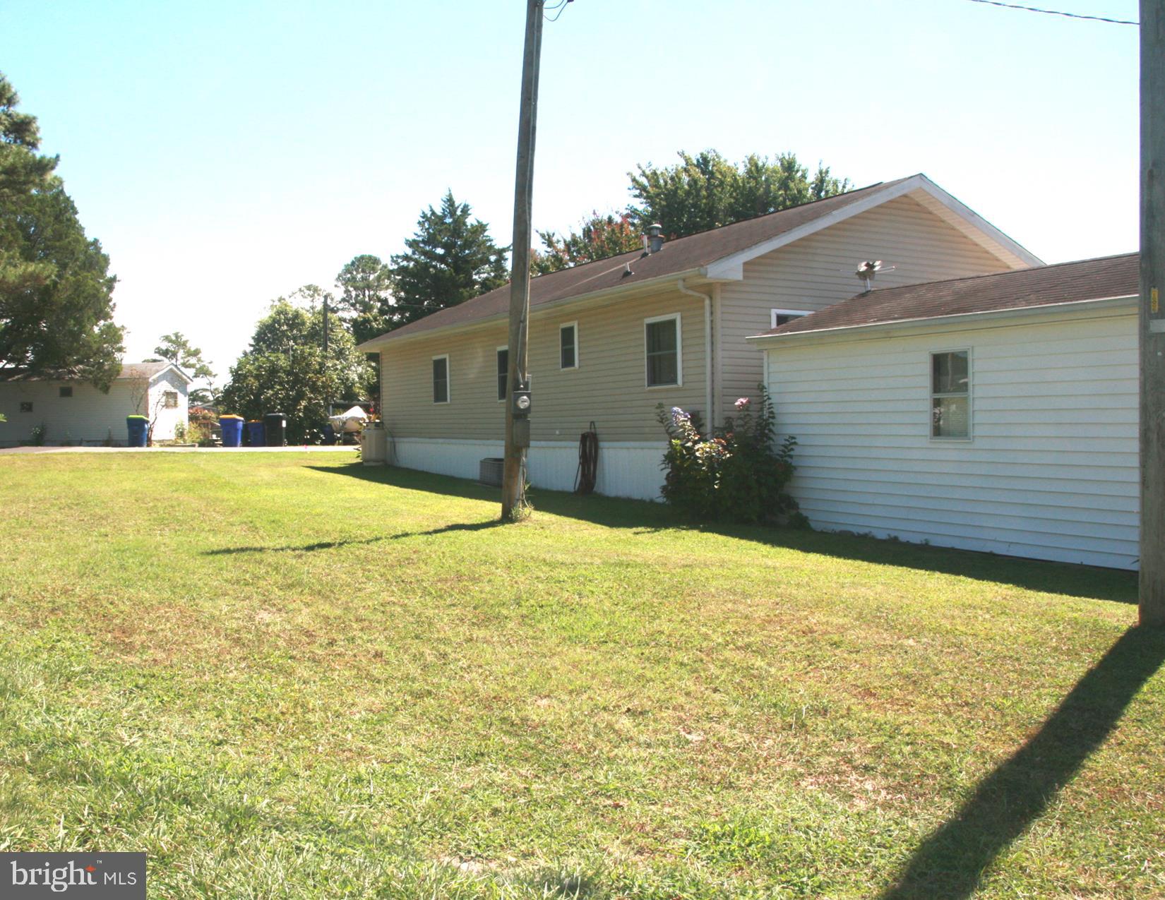 35317 Fishermans Road, Unit 5751 Millsboro, DE 19966 - Photo 11 of 34 Rear West Side Yard
