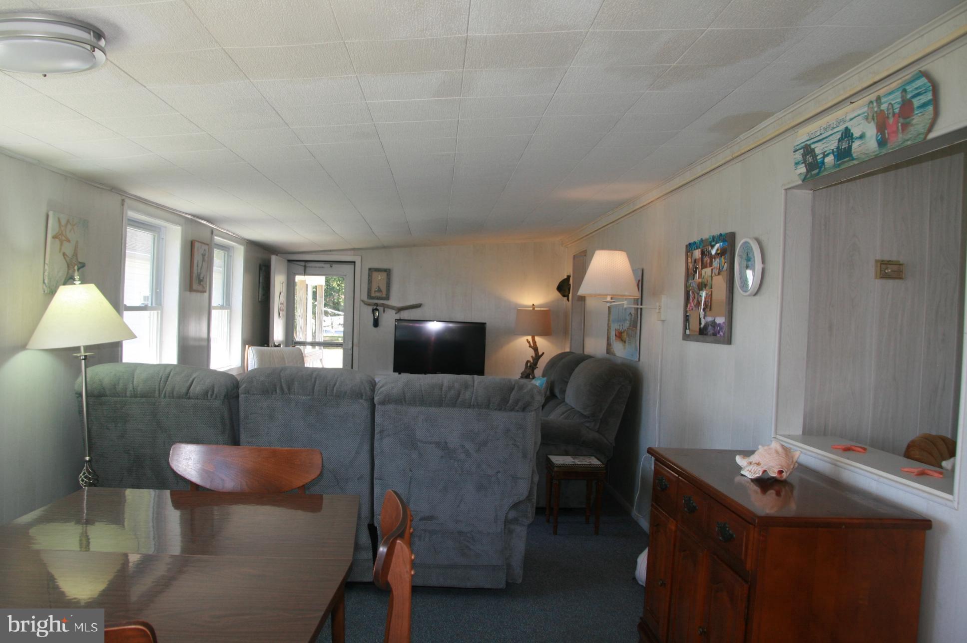 35317 Fishermans Road, Unit 5751 Millsboro, DE 19966 - Photo 17 of 34 Dining Room & Living Room