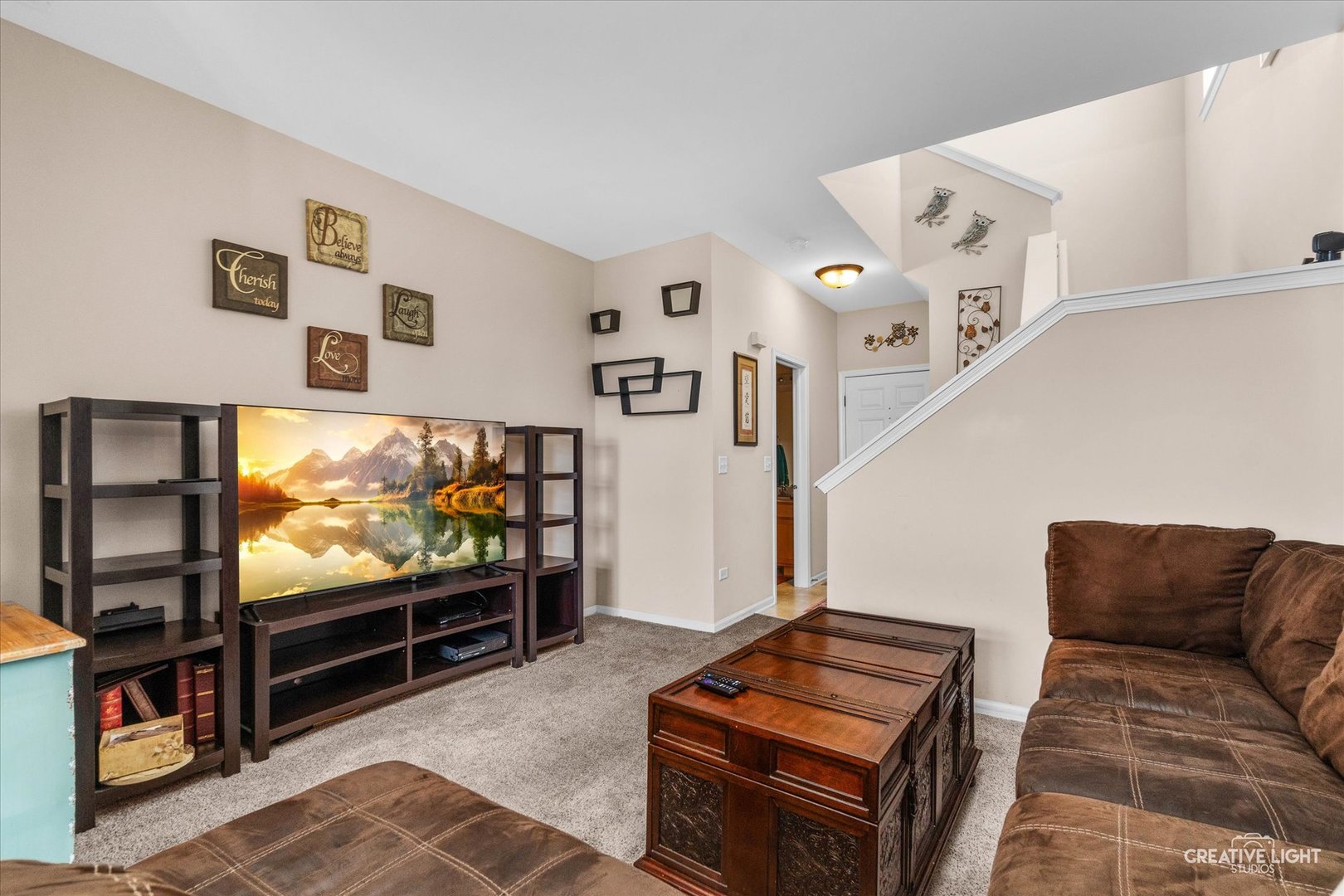 2913 Alyssa Street Plano, IL 60545 - Photo 2 of 19 a living room with furniture and a flat screen tv
