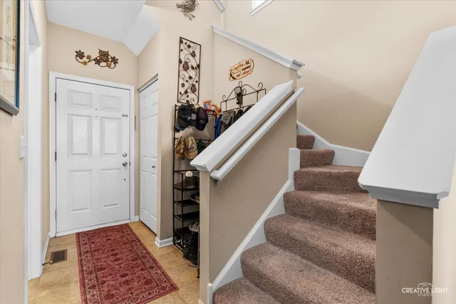 a view of entryway with furniture and rug
