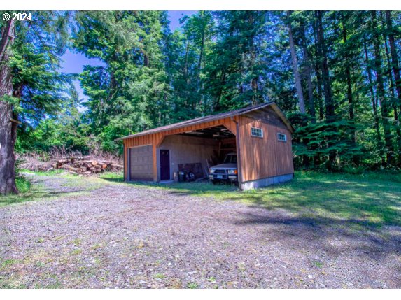 9010 Southeast Bull Run Road Corbett, OR 97019 - Photo 18 of 21 a backyard of a house with lots of green space