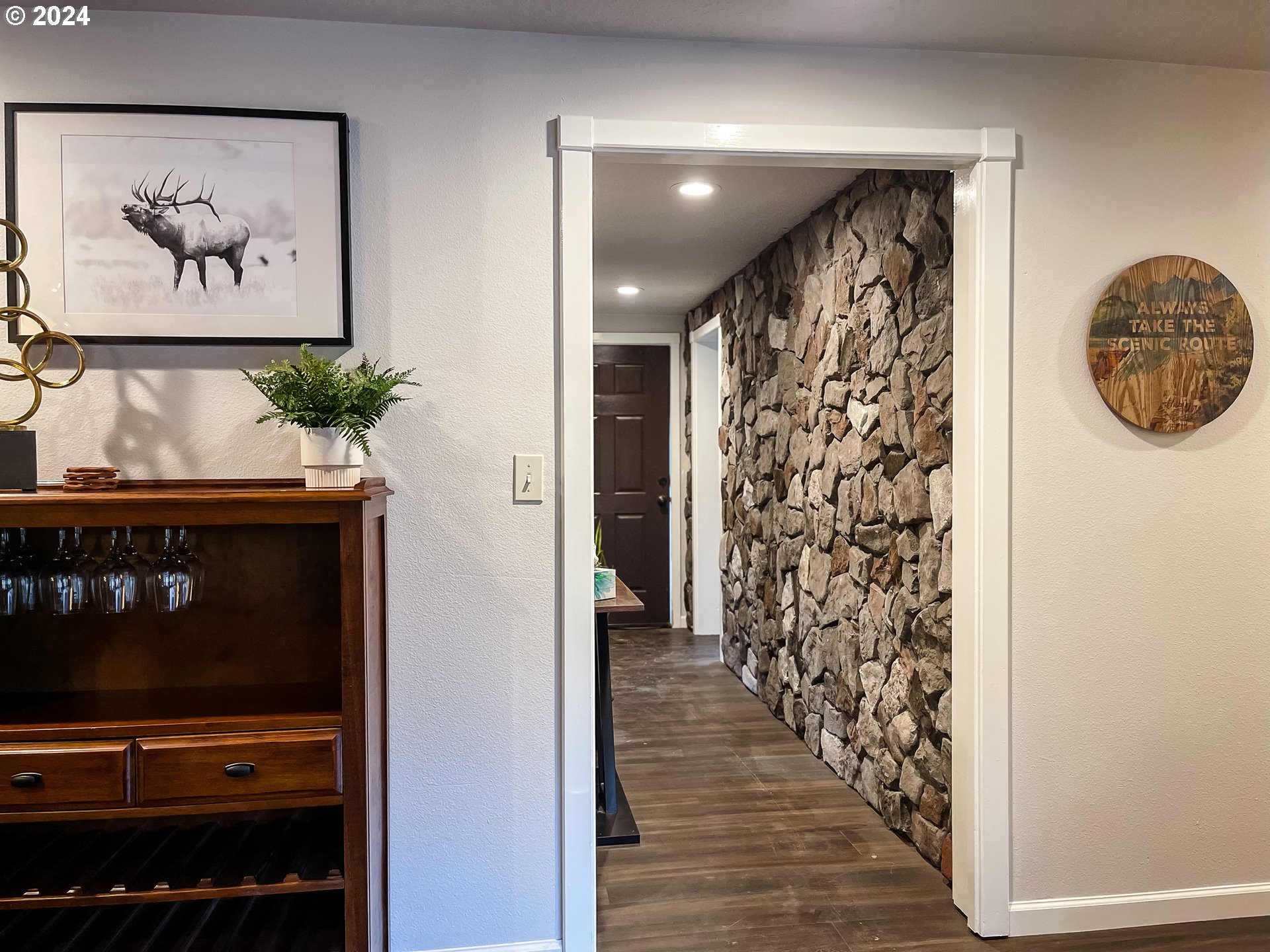 9010 Southeast Bull Run Road Corbett, OR 97019 - Photo 5 of 21 a view of a hallway with wooden floor and a floor to ceiling window