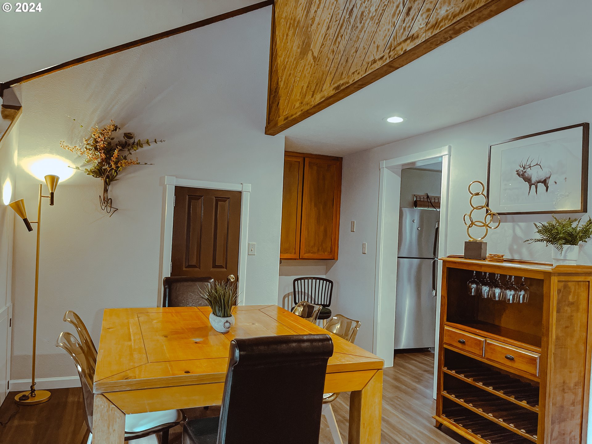 9010 Southeast Bull Run Road Corbett, OR 97019 - Photo 6 of 21 a view of a dining room with furniture and wooden floor