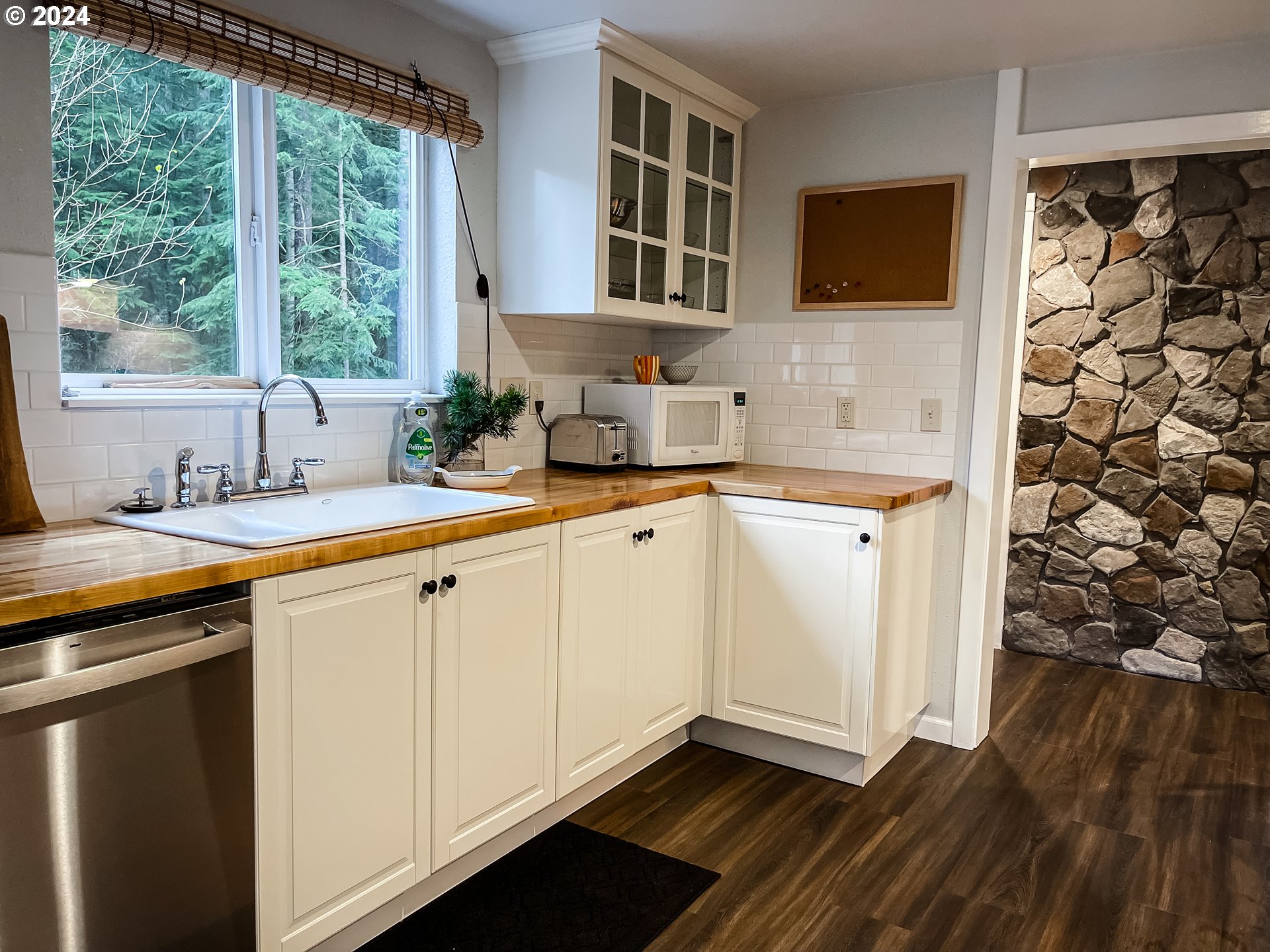 9010 Southeast Bull Run Road Corbett, OR 97019 - Photo 9 of 21 a kitchen with stainless steel appliances granite countertop a sink and a stove