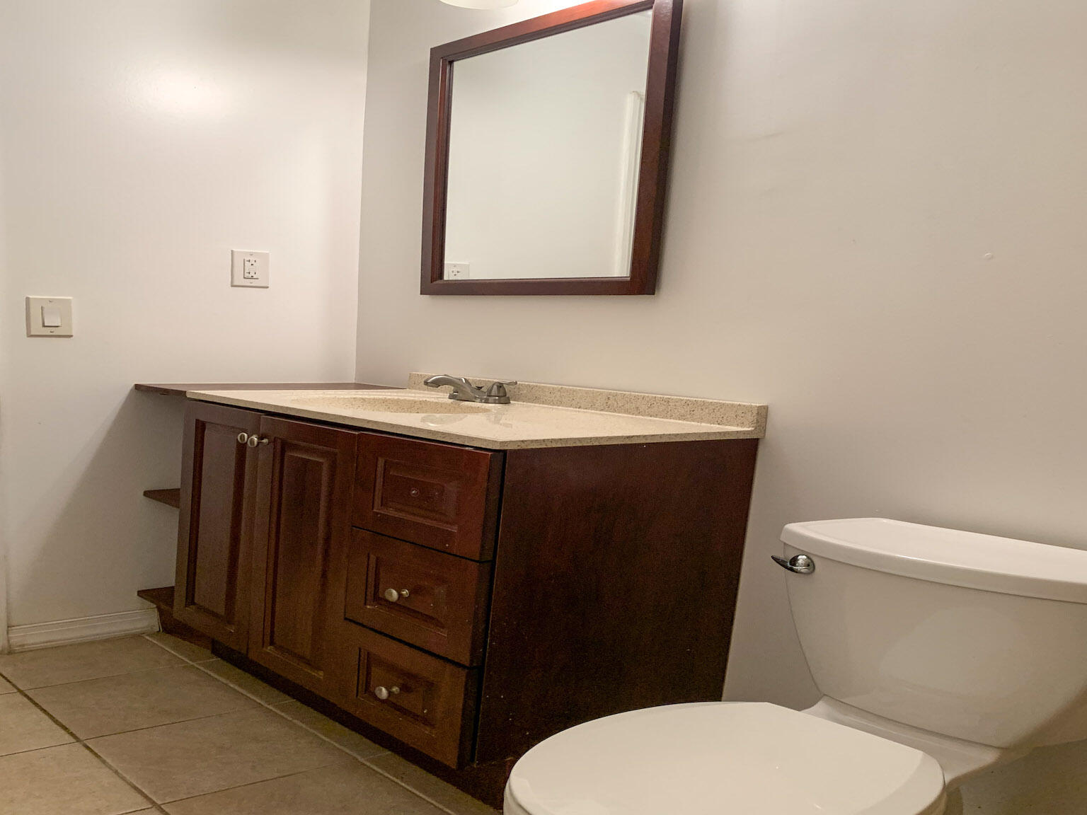 17 6th Avenue Stock Island, FL 33040 - Photo 22 of 28 a bathroom with a toilet a sink and mirror