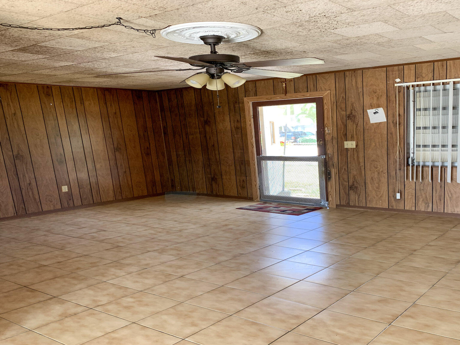 17 6th Avenue Stock Island, FL 33040 - Photo 24 of 28 a view of livingroom with window chandelier fan and front door