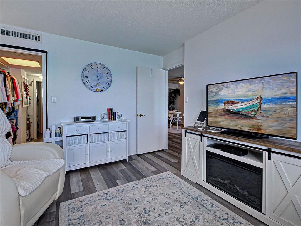633 Alhambra Road, Unit 1006 Venice, FL 34285 - Photo 35 of 55 a living room with furniture and a fireplace