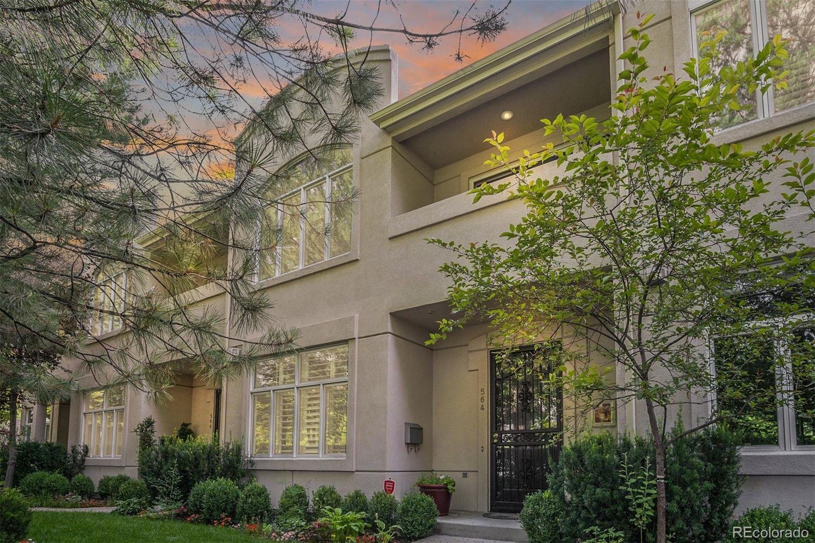 Perfectly hidden behind tall hedges in the heart of Cherry Creek, this elegant exterior is welcoming and private