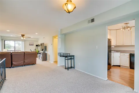 a view of a kitchen with a sink and cabinets
