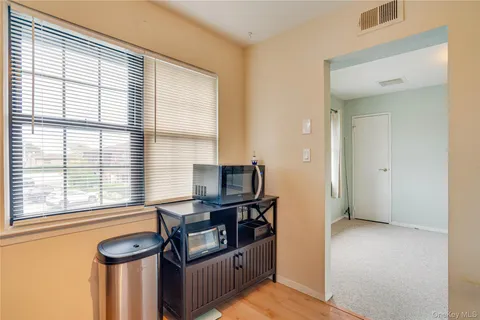 a view of a livingroom with furniture and windows