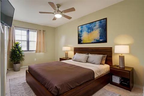 a bedroom with furniture and a lamp