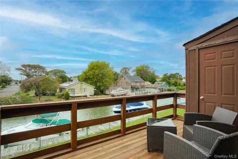 a view of a two chairs in the balcony