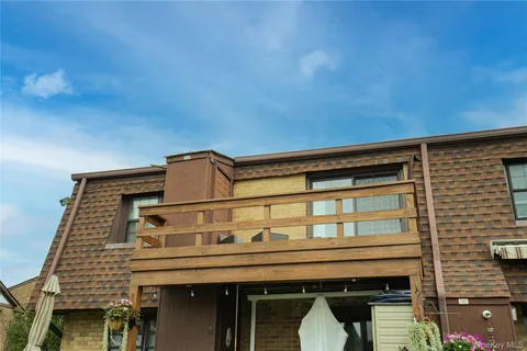 a front view of a house with barbeque area