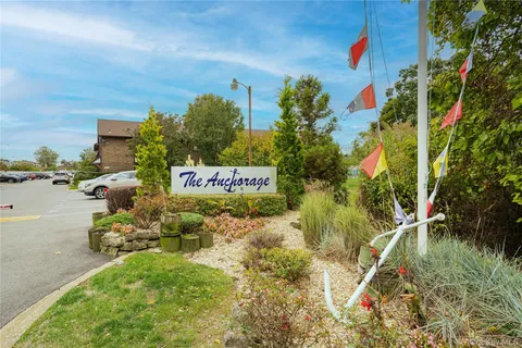 a sign that is on a brick wall