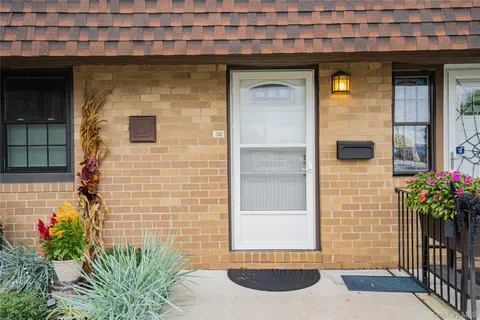 a front view of a house with a porch