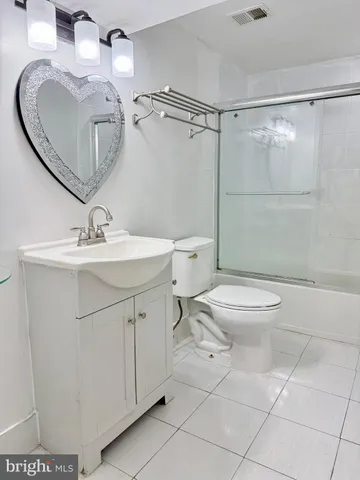 a view of a house with wooden fence