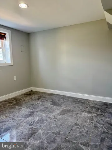 a bathroom with a sink toilet a mirror and shower