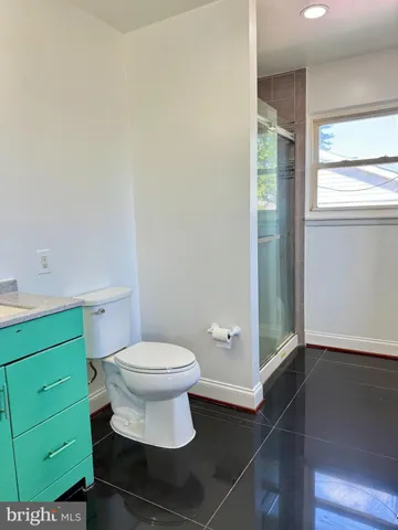 a bathroom with a toilet and a sink
