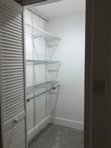 a view of a room with racks on the wall