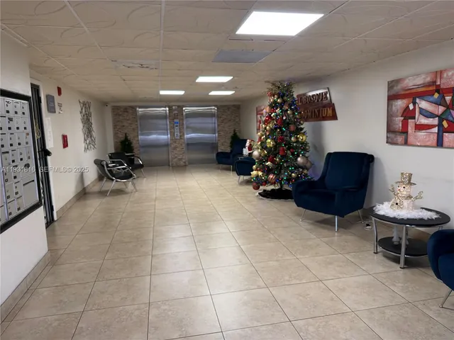 a room with furniture and a flat screen tv